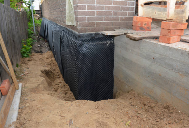 Happy homeowners after waterproofing job in Farner